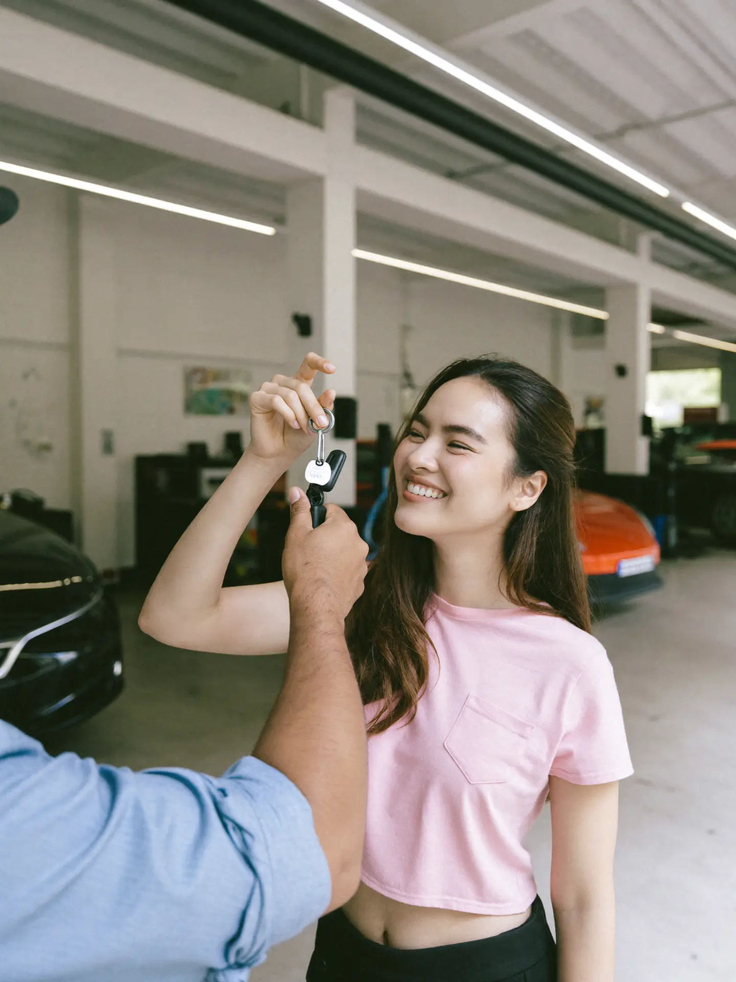 Woman receiving her car keys back